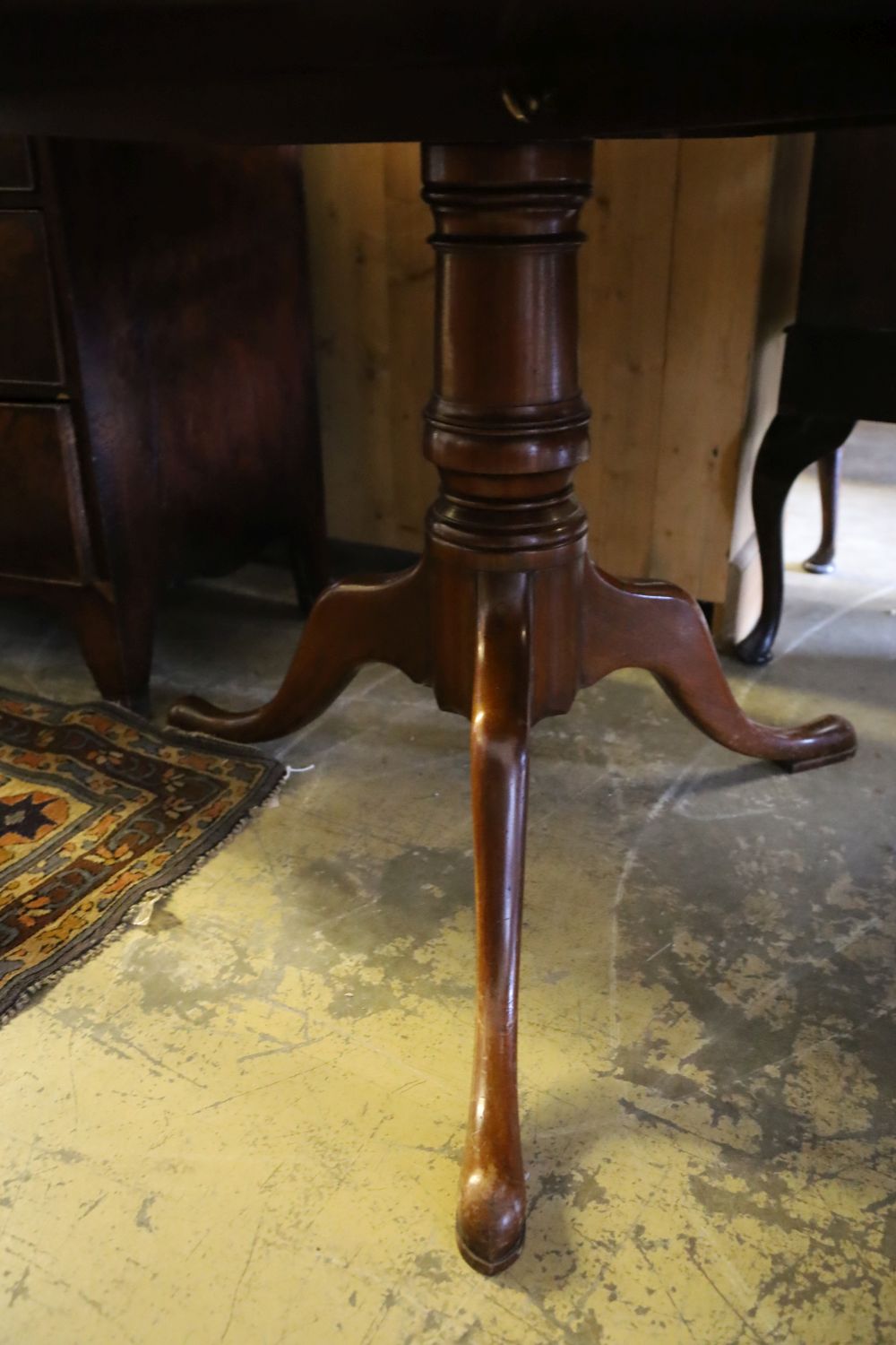 A mahogany snap-top tea table, diameter 106cm height 75cm